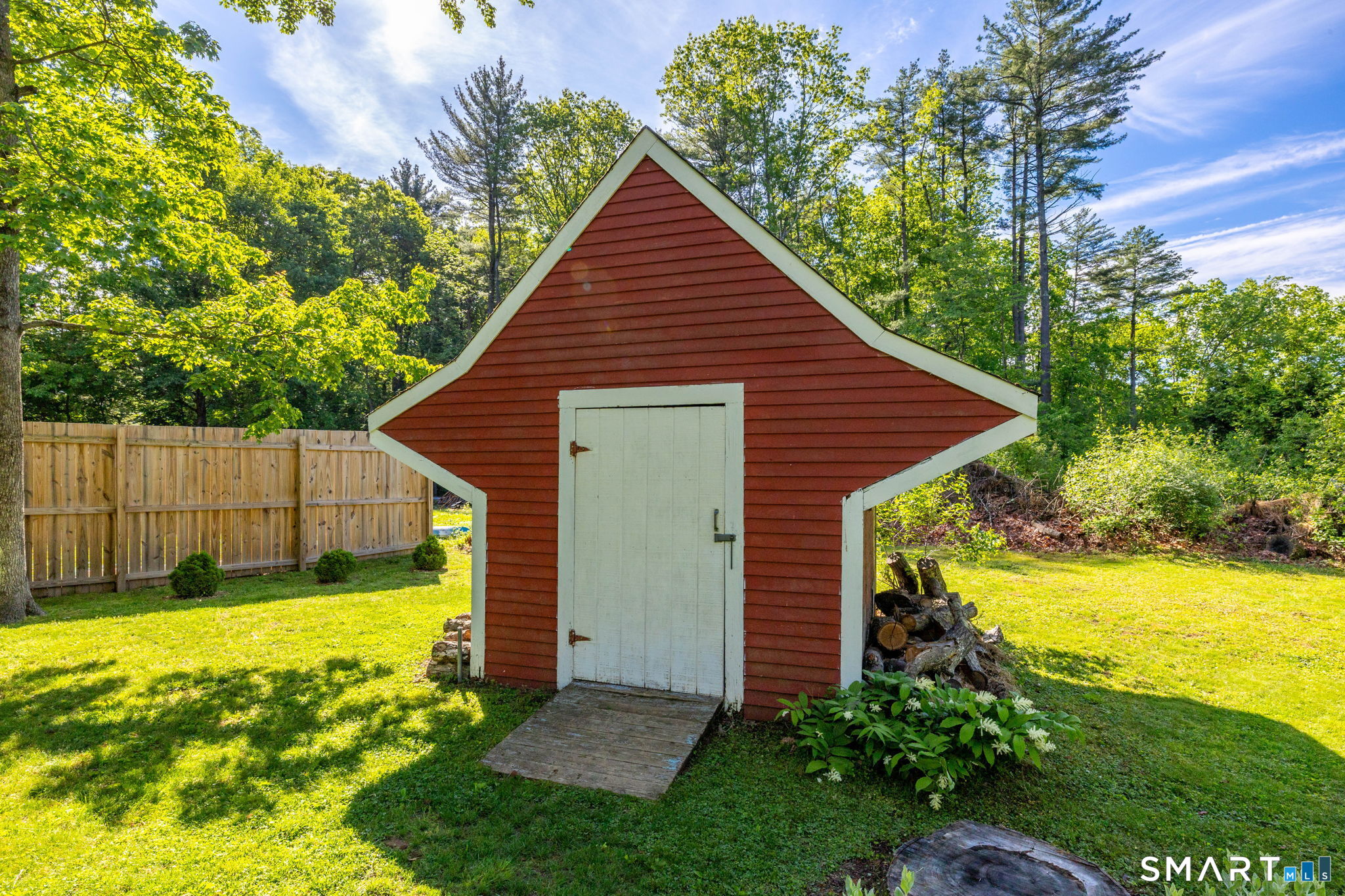 347 Griffin Road Suffield, CT 06093 - Photo 28 of 35 a view of a backyard with a small cabin