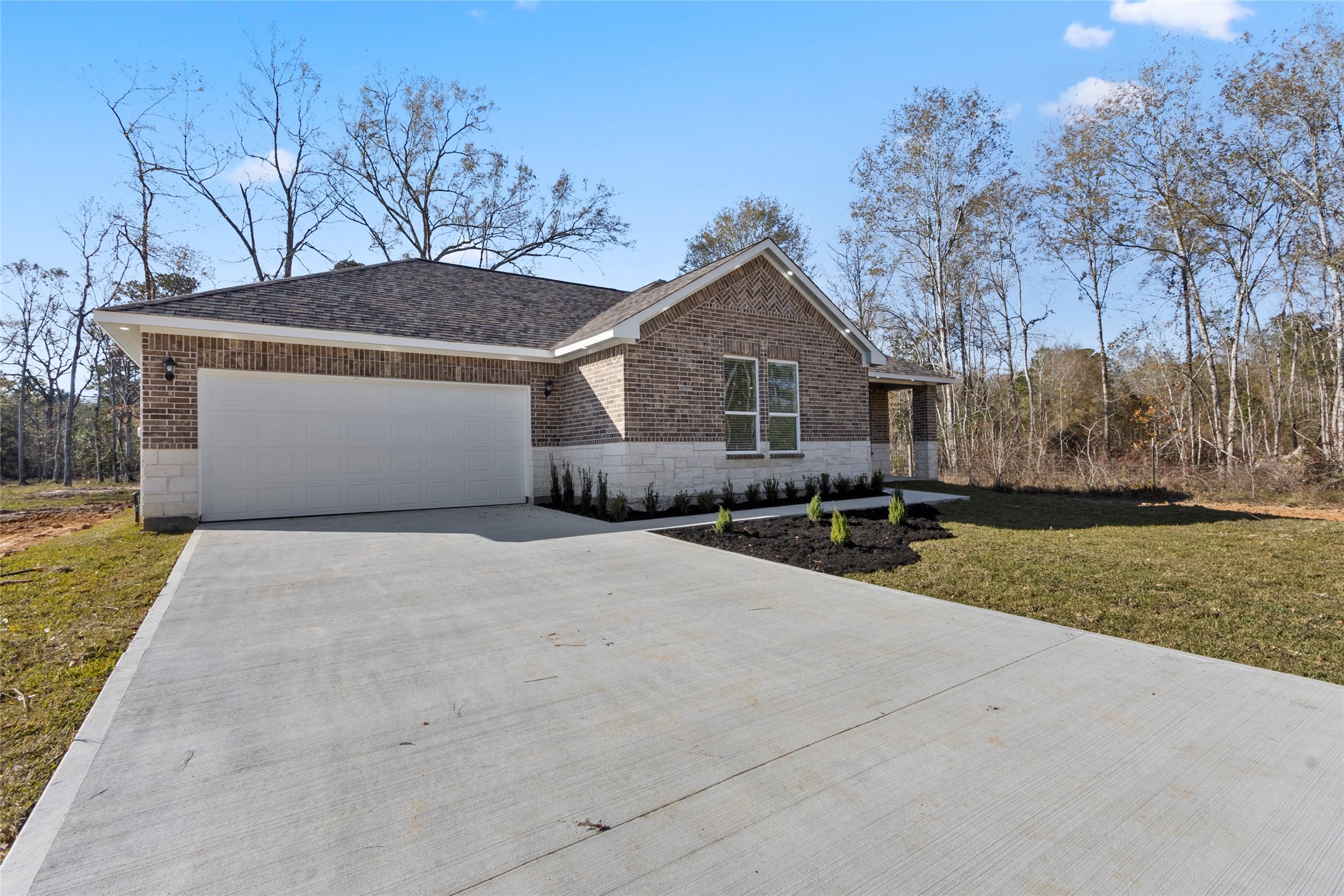 155 County Road 3372 Cleveland, TX 77327 - Photo 15 of 36 a front view of house with yard and trees