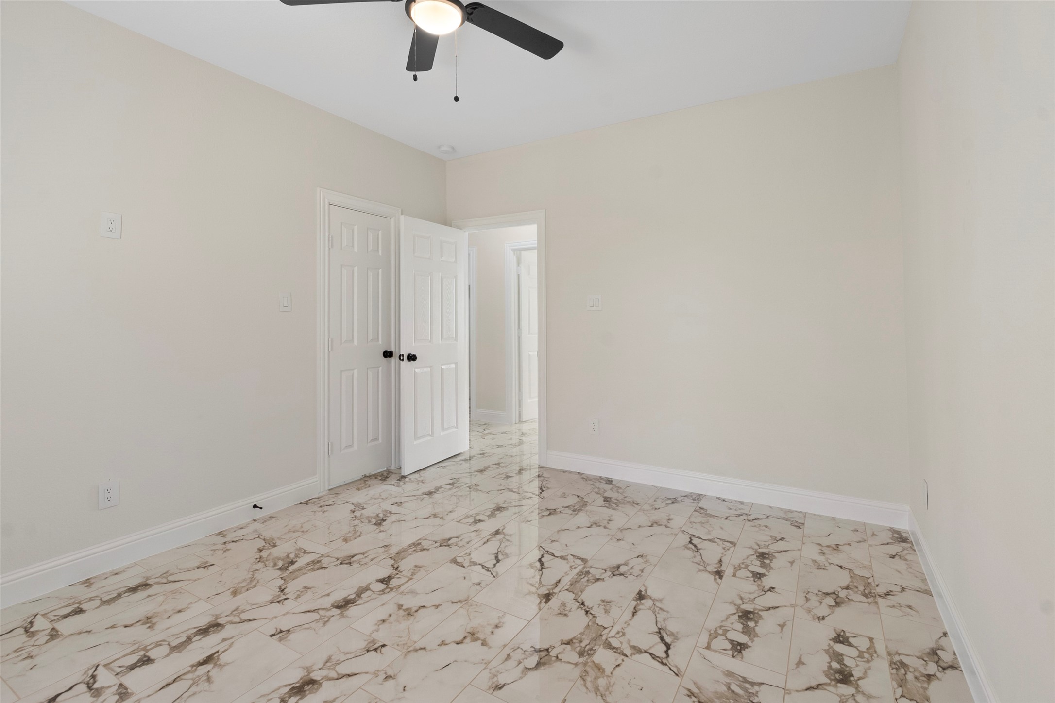 155 County Road 3372 Cleveland, TX 77327 - Photo 23 of 36 an empty room with a natural light