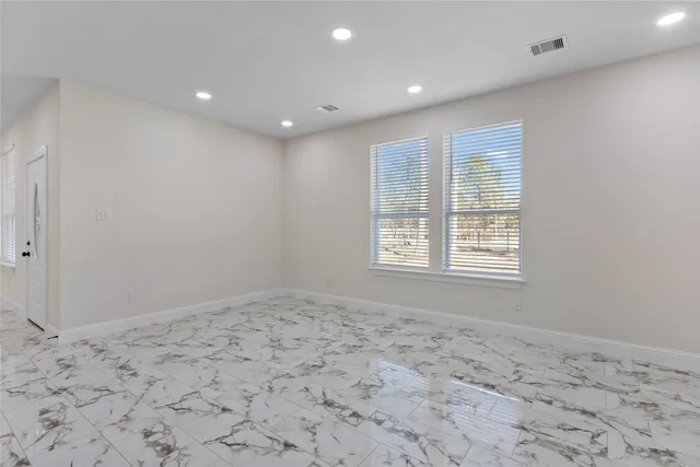 a view of a big room with wooden floor and bedroom