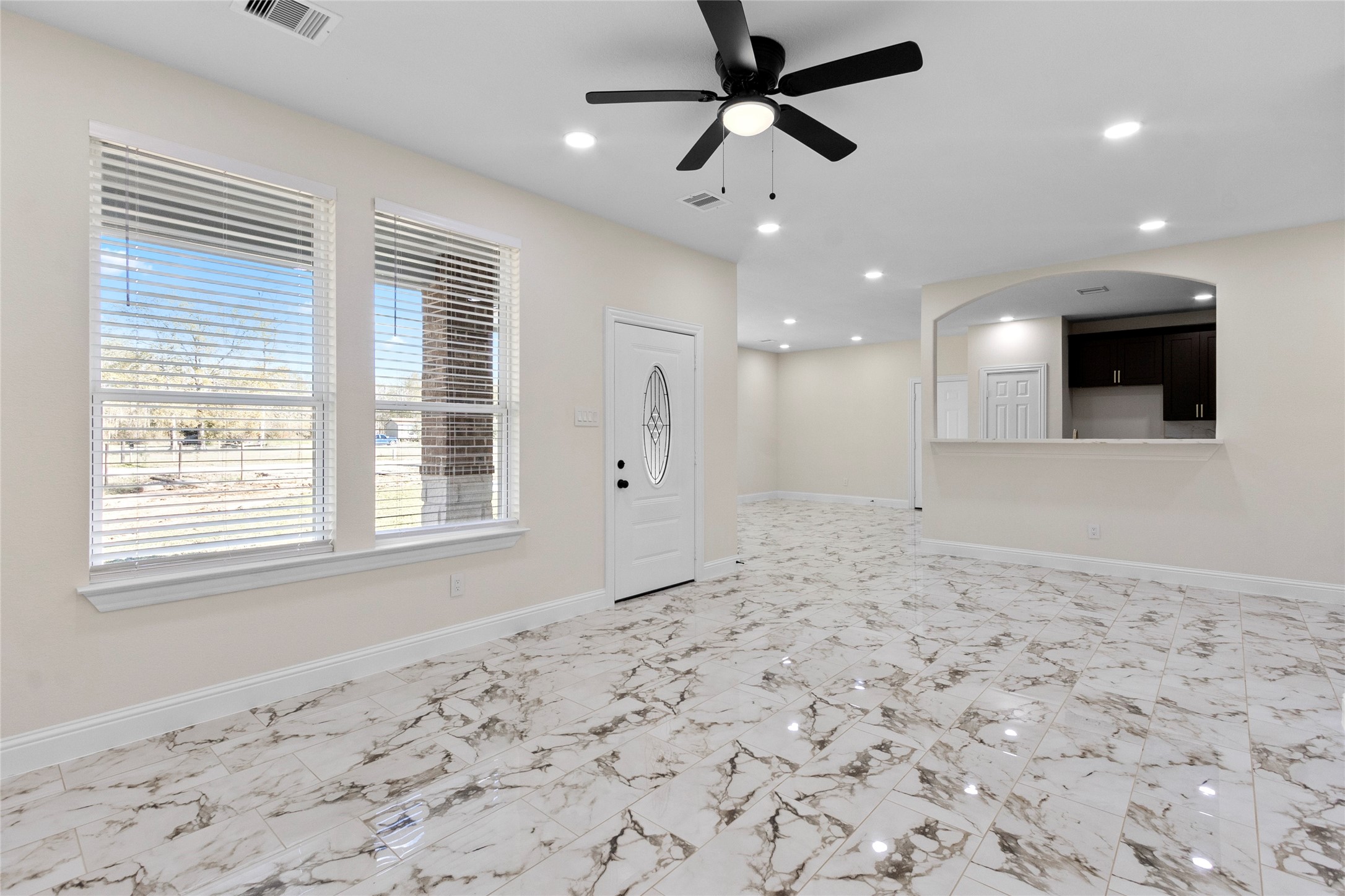 155 County Road 3372 Cleveland, TX 77327 - Photo 32 of 36 a view of a livingroom with a chandelier fan and a window