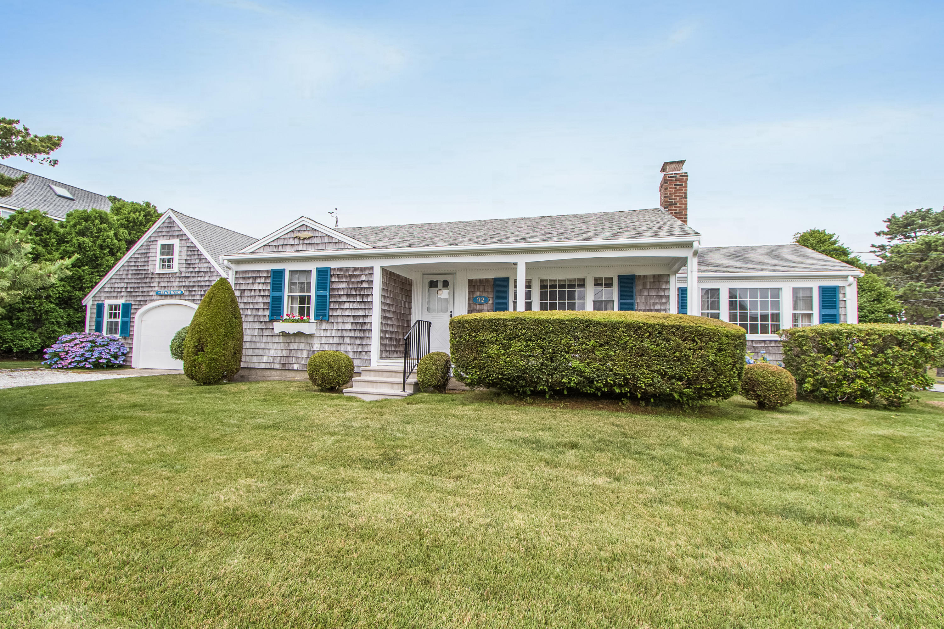 92 Surfside Road West Dennis, MA 02670 - Photo 1 of 38 a view of a house with a yard and sitting area