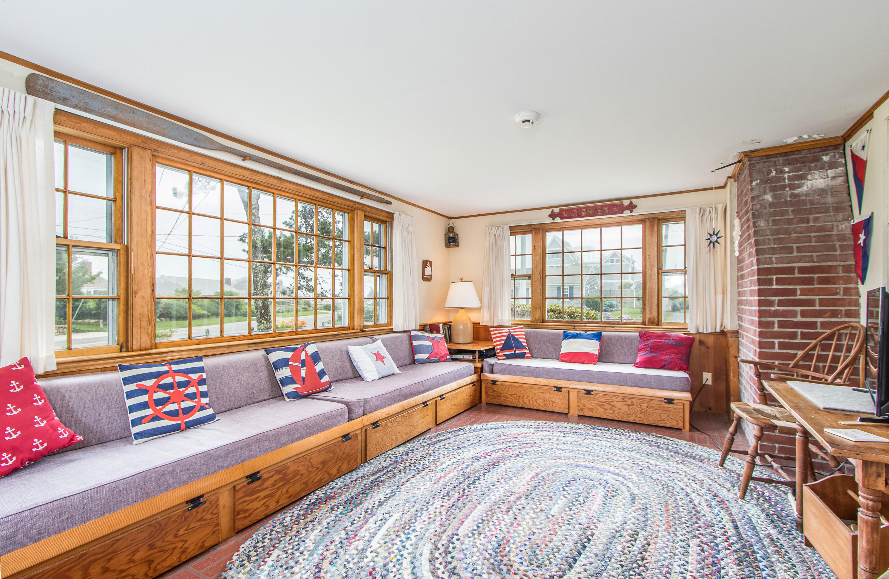 92 Surfside Road West Dennis, MA 02670 - Photo 11 of 38 a living room with furniture and a floor to ceiling window