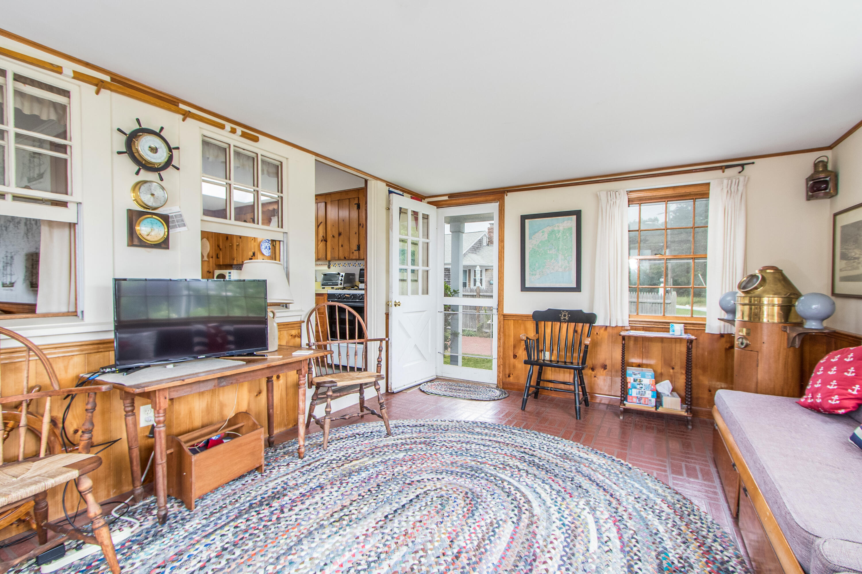 92 Surfside Road West Dennis, MA 02670 - Photo 14 of 38 a bedroom with furniture and a fireplace