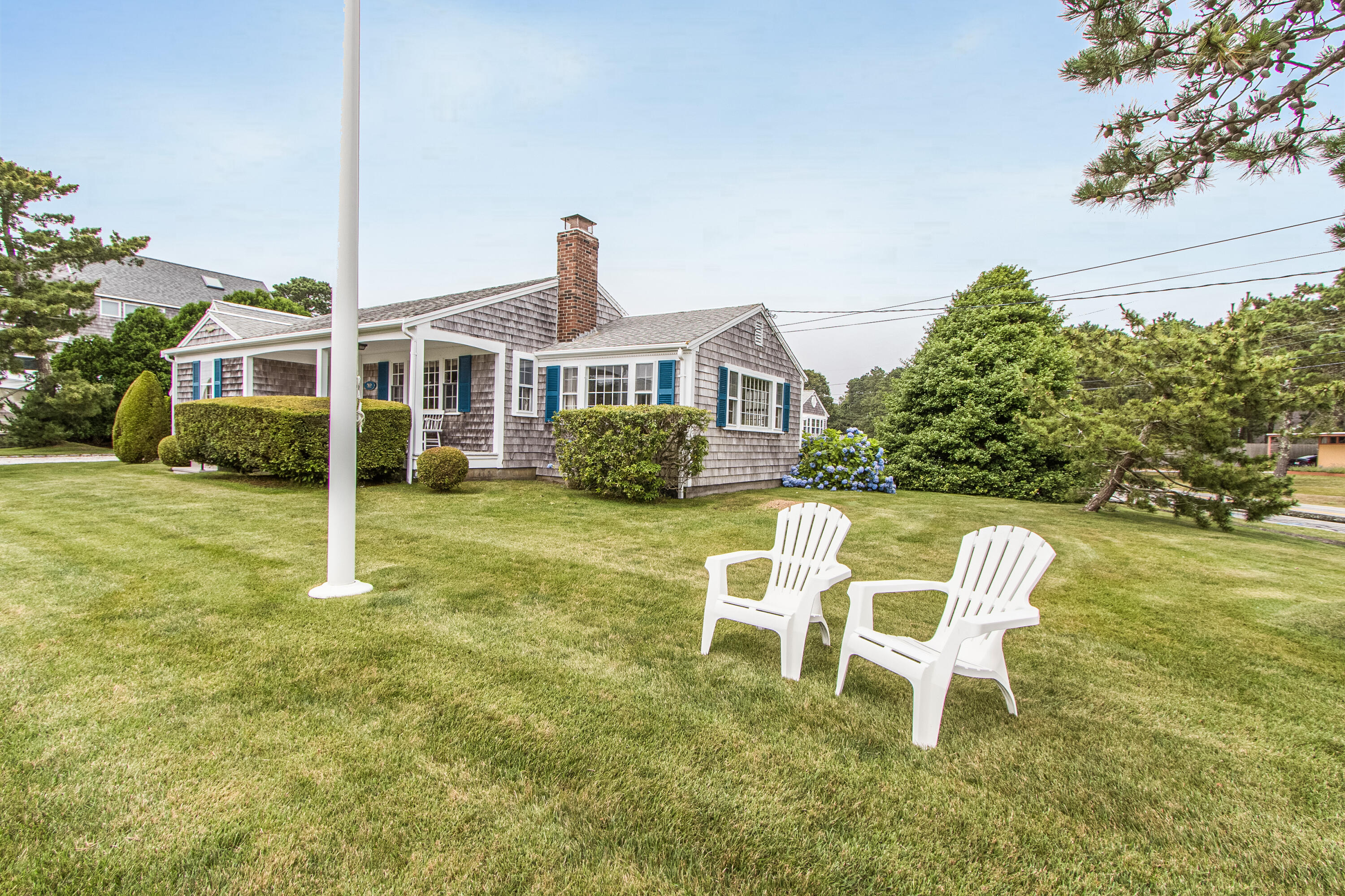 92 Surfside Road West Dennis, MA 02670 - Photo 2 of 38 a house view with a seating space