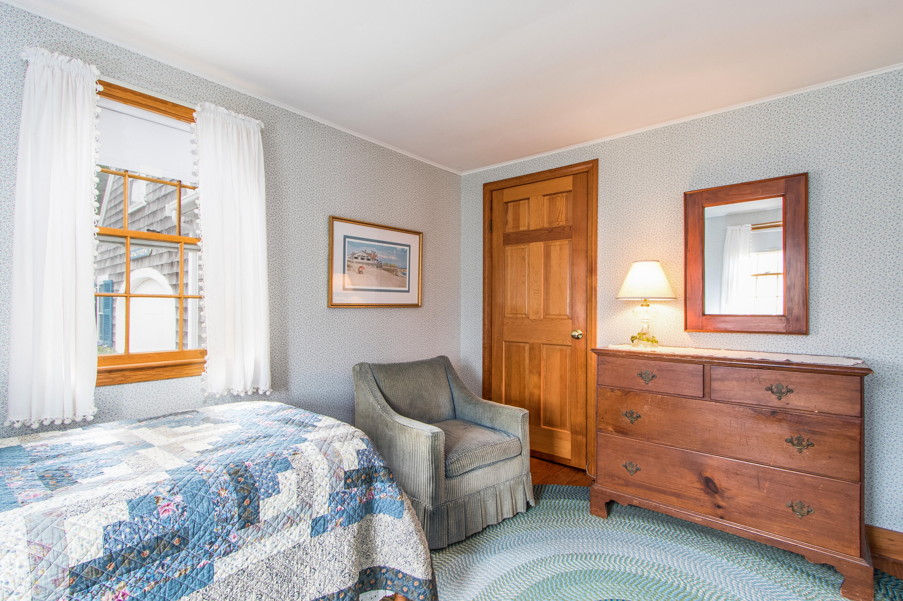 92 Surfside Road West Dennis, MA 02670 - Photo 21 of 38 a bedroom with a bed and a dresser