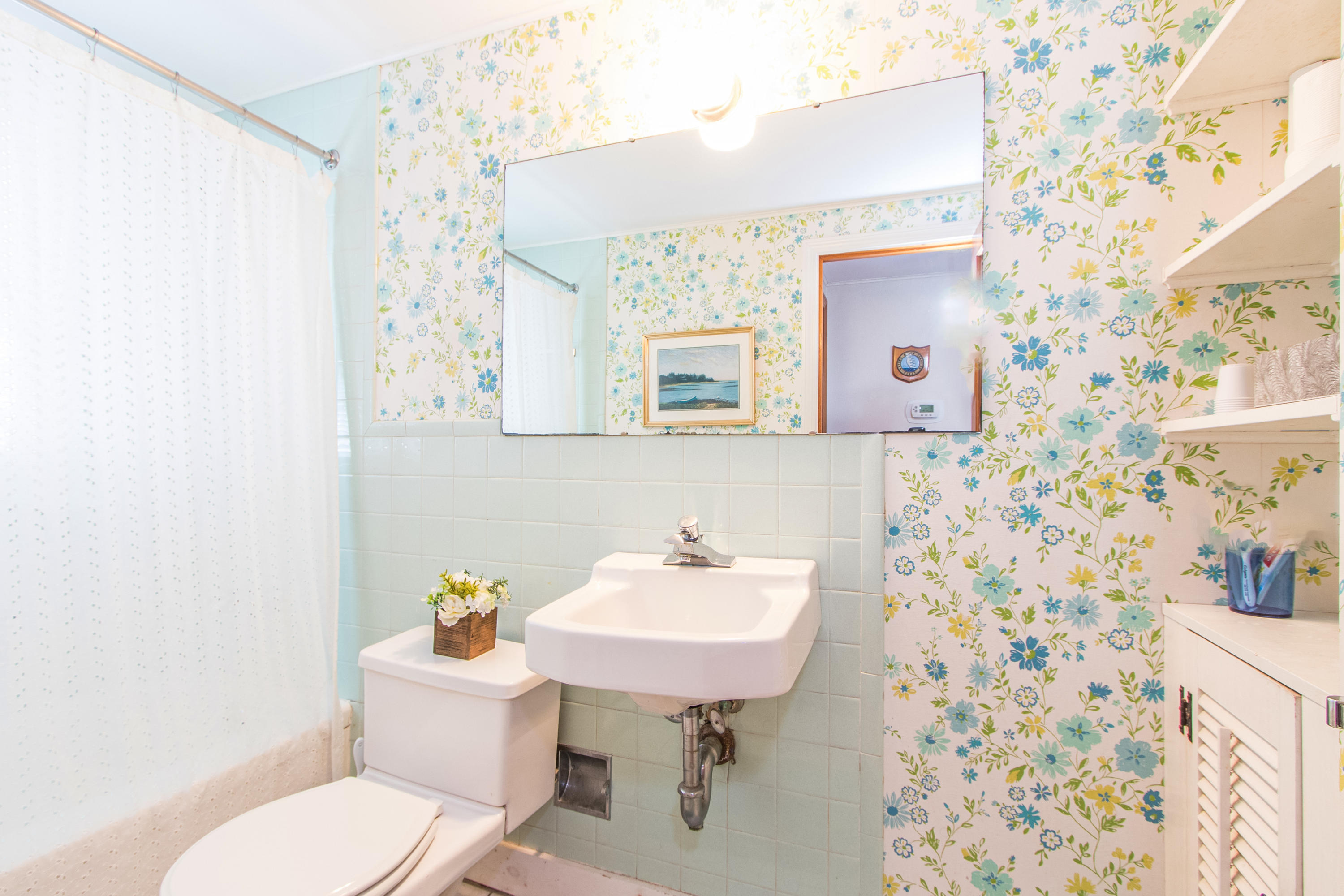 92 Surfside Road West Dennis, MA 02670 - Photo 22 of 38 a bathroom with a sink toilet and mirror