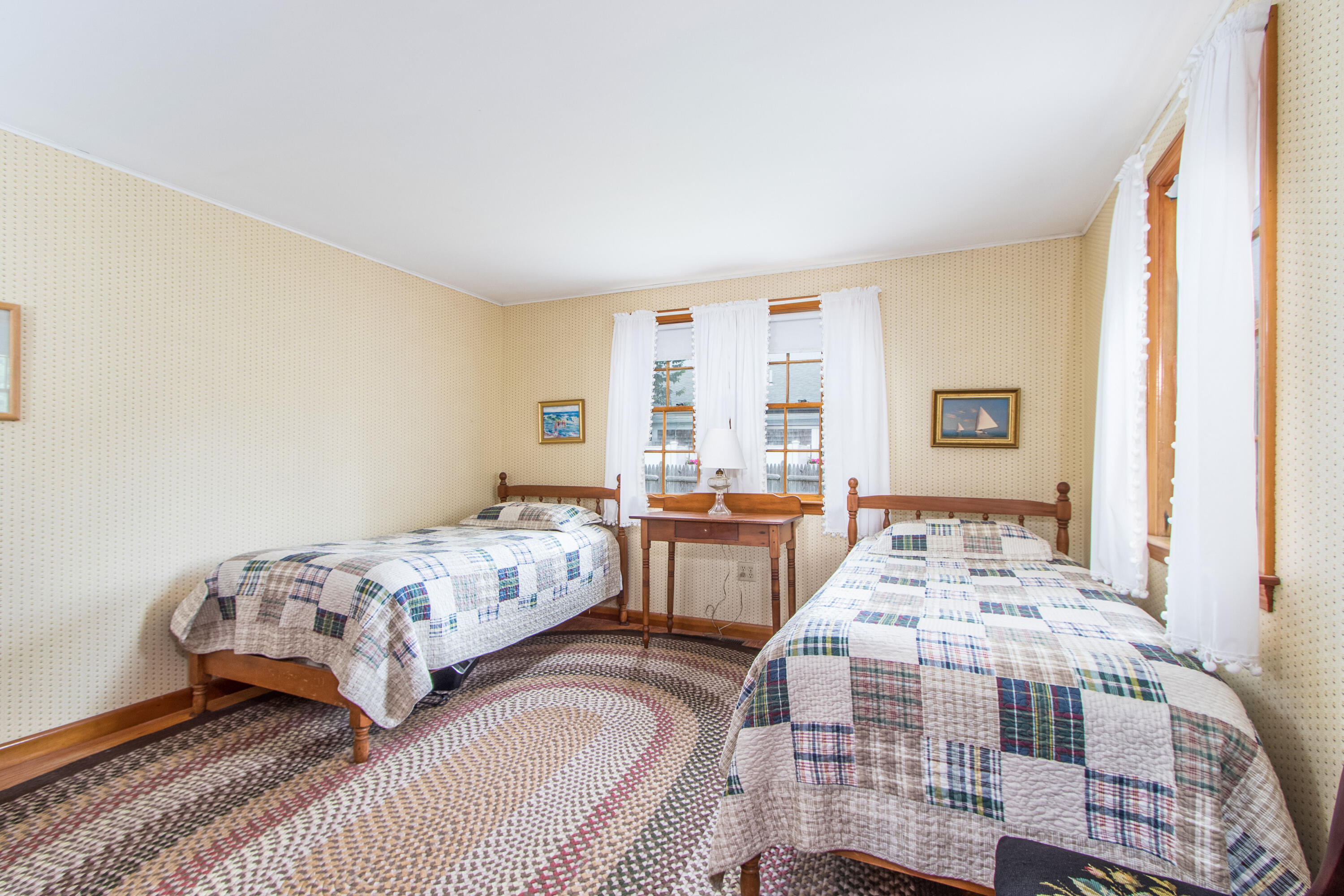 92 Surfside Road West Dennis, MA 02670 - Photo 23 of 38 a bedroom with two beds and a table