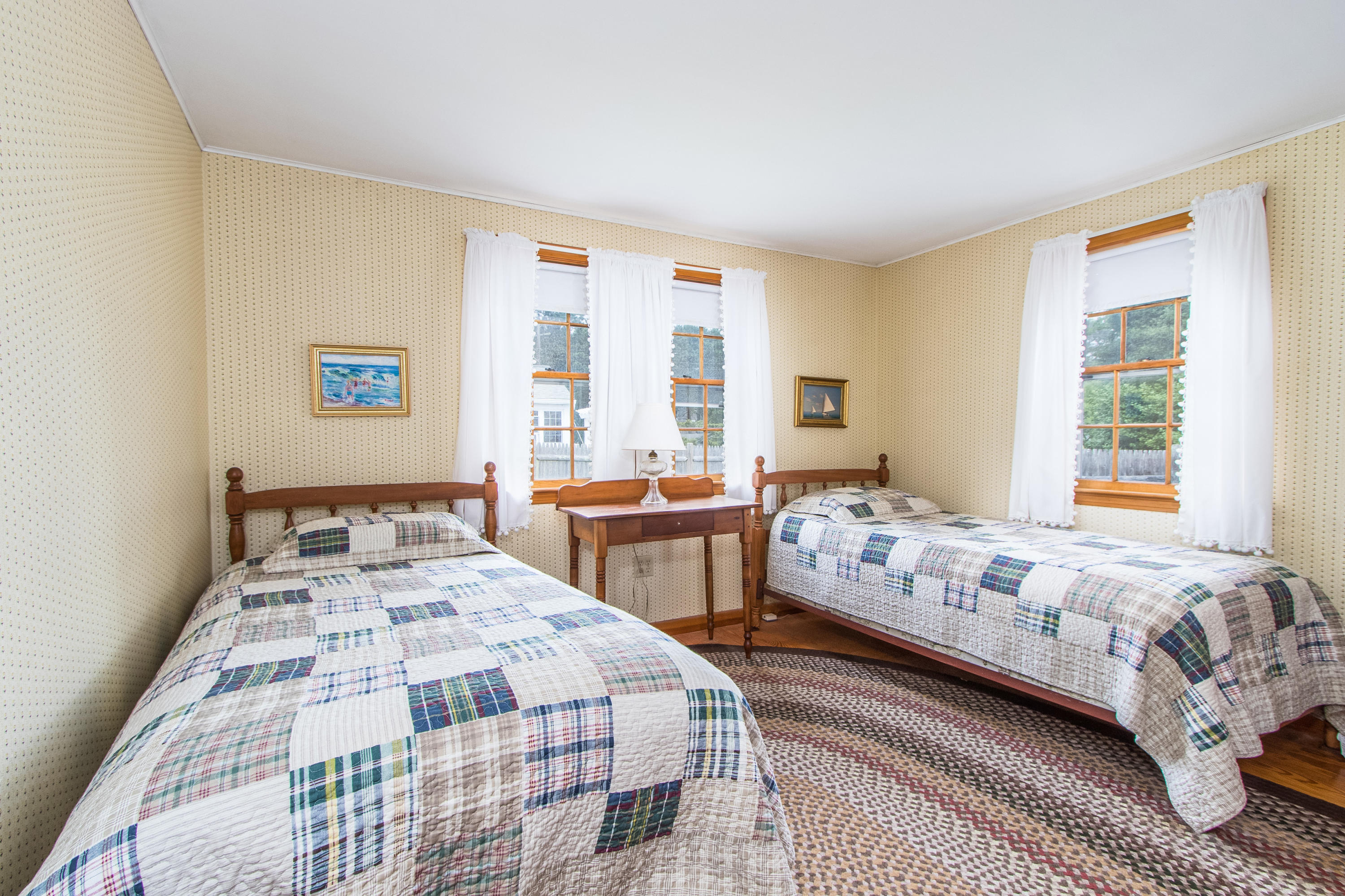 92 Surfside Road West Dennis, MA 02670 - Photo 24 of 38 a bedroom with two beds and a large window