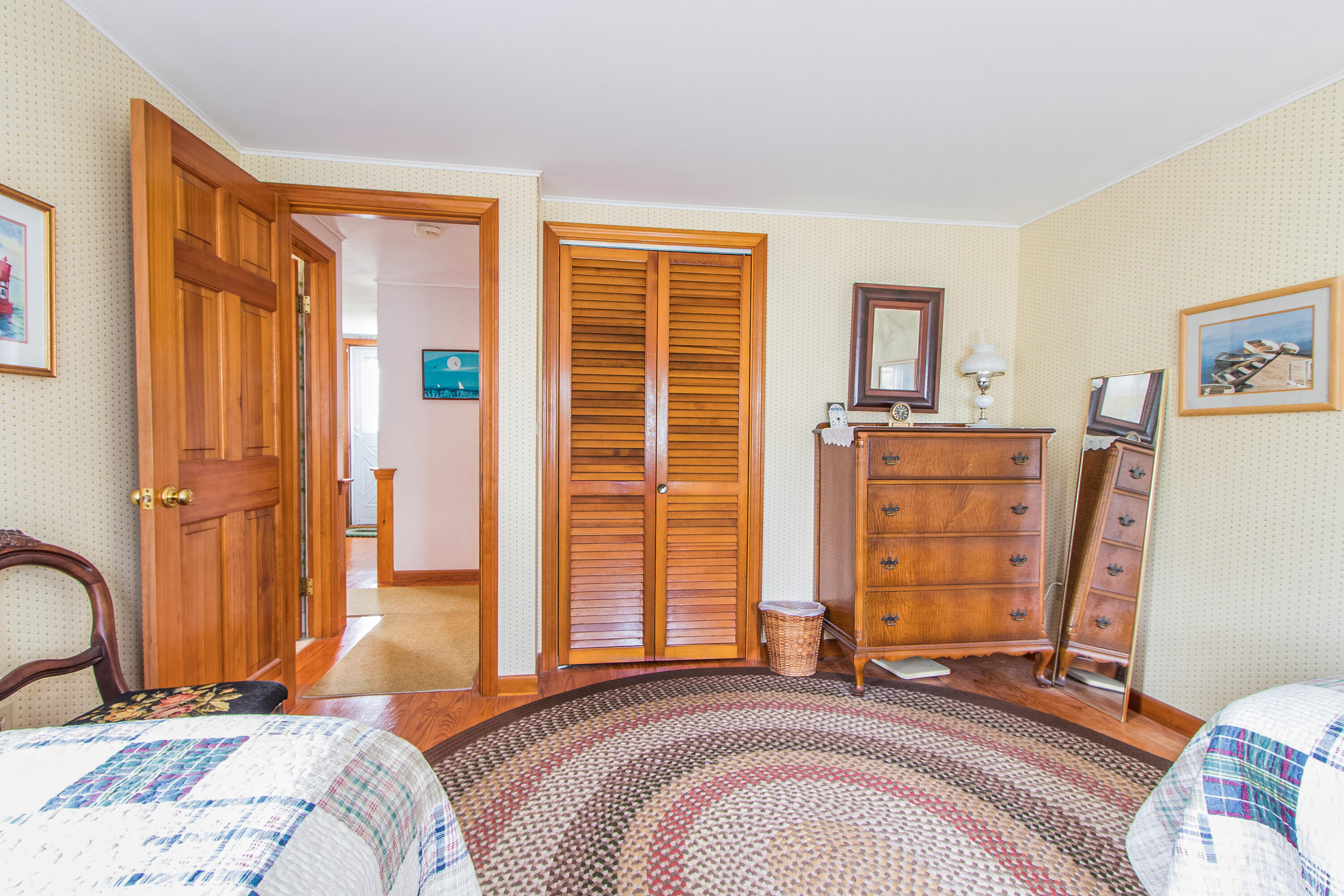 92 Surfside Road West Dennis, MA 02670 - Photo 25 of 38 a bedroom with bed and a dresser