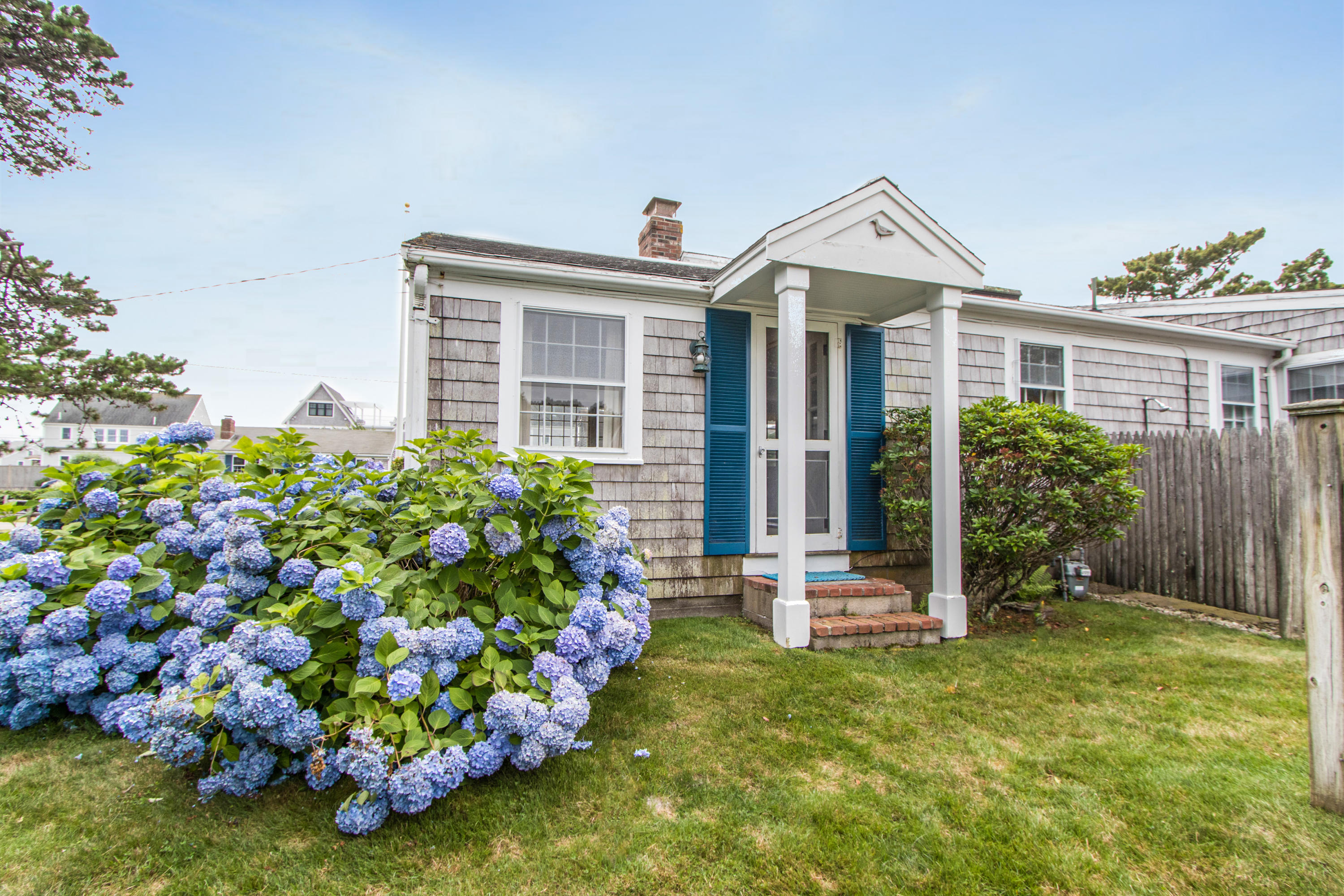 92 Surfside Road West Dennis, MA 02670 - Photo 31 of 38 front view of a house with a yard