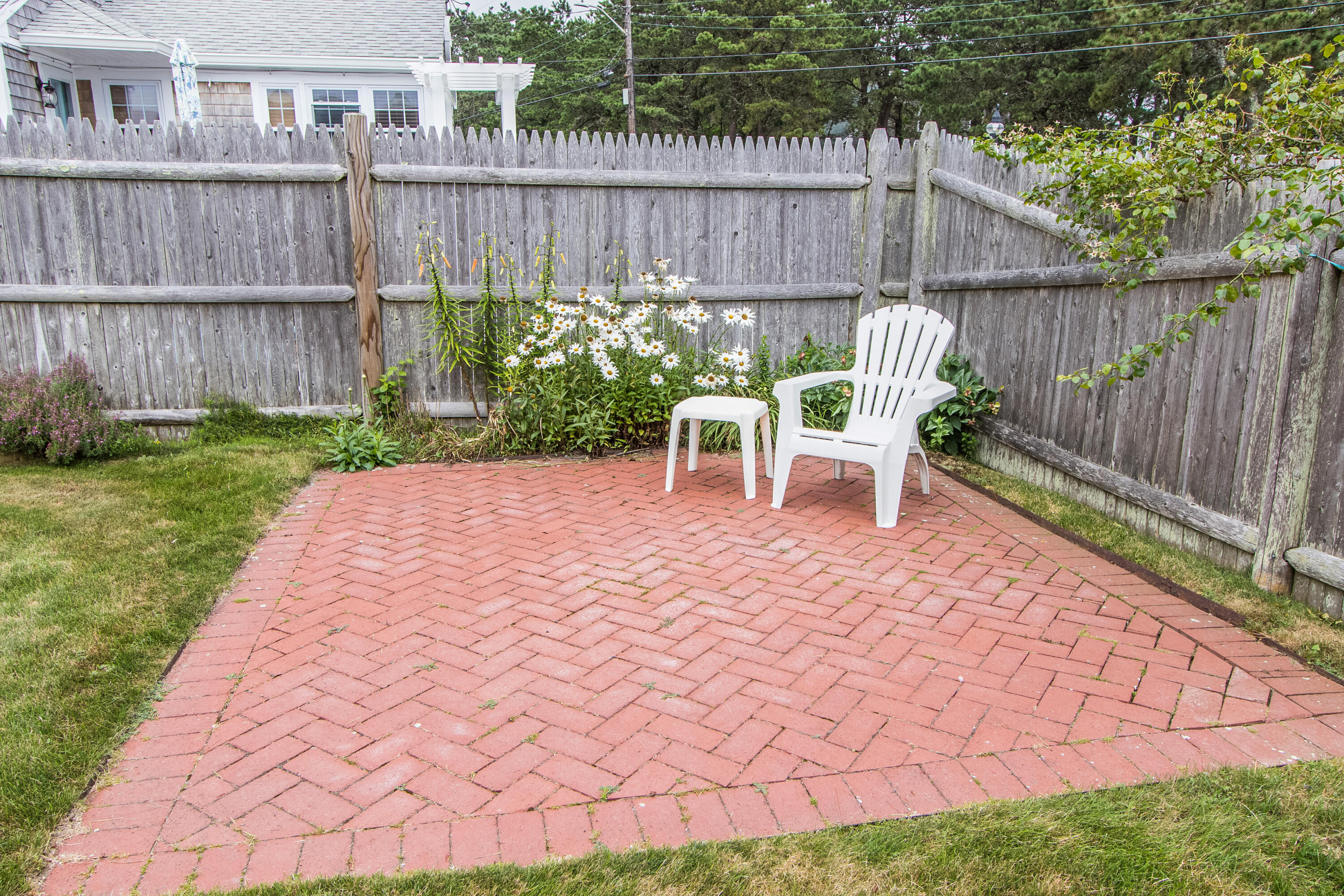 92 Surfside Road West Dennis, MA 02670 - Photo 32 of 38 a view of a deck with furniture and a yard