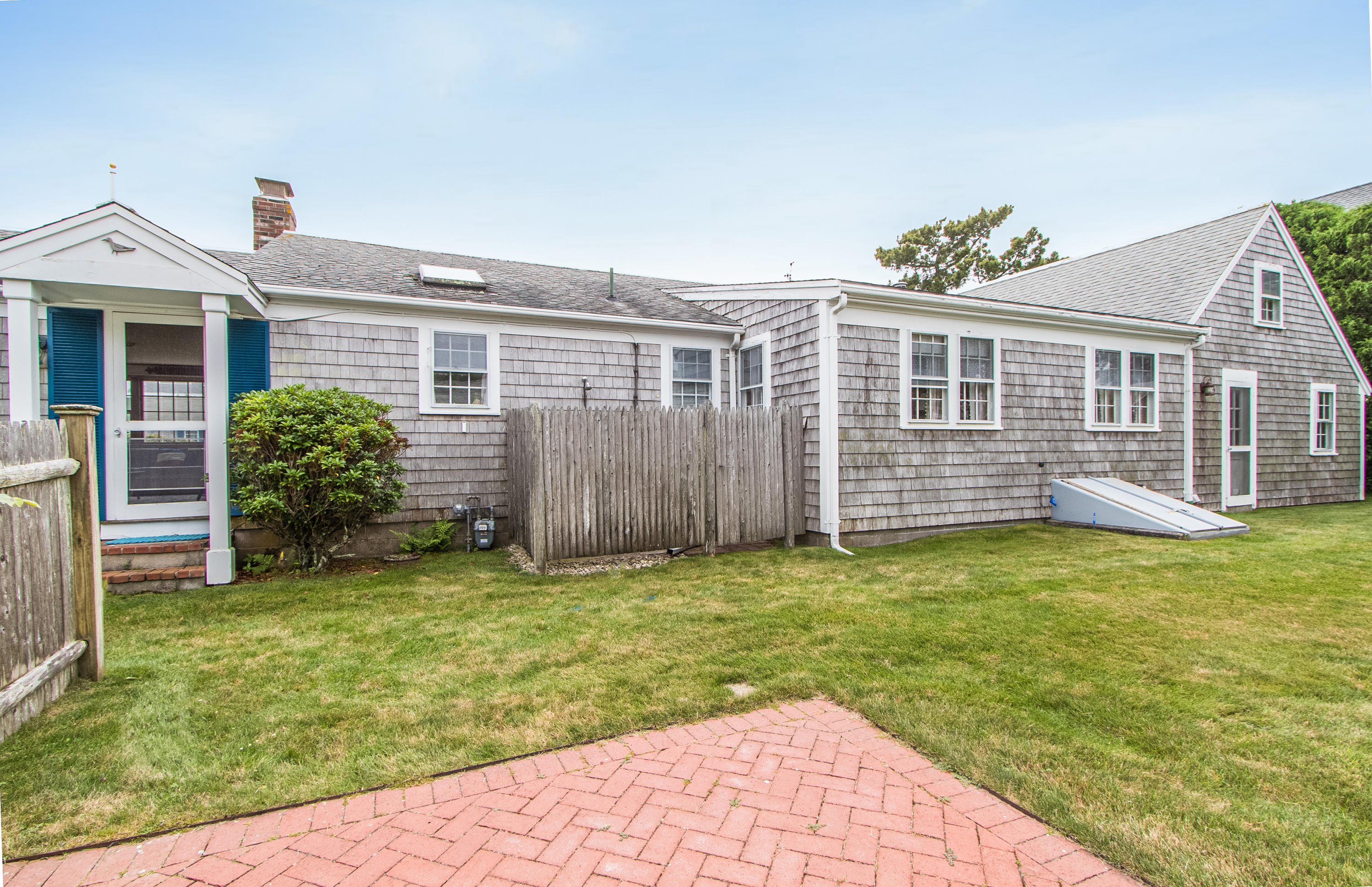 92 Surfside Road West Dennis, MA 02670 - Photo 33 of 38 a view of a house with a yard