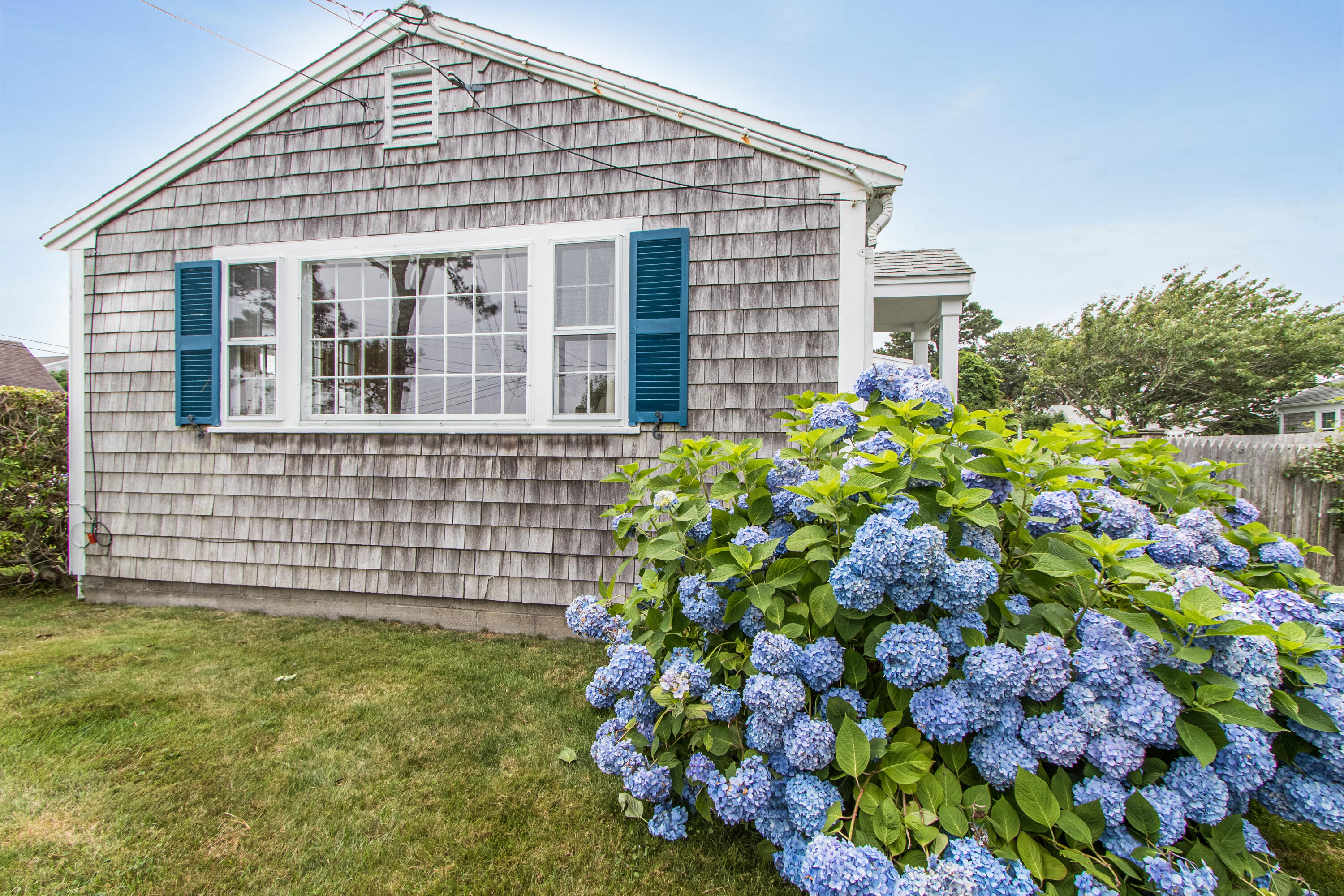 92 Surfside Road West Dennis, MA 02670 - Photo 35 of 38 a front view of a house with a yard