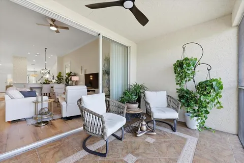 a living room with patio furniture