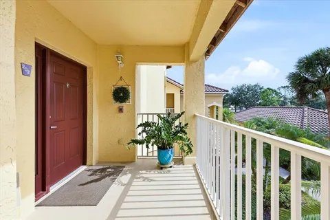 a view of a balcony with wooden floor
