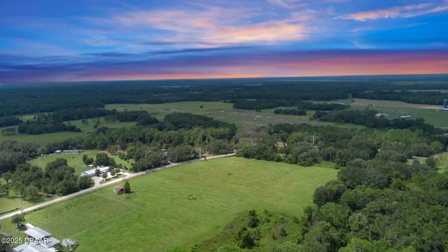 a view of a field with an ocean