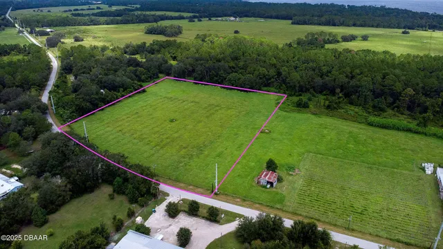 an aerial view of a golf course with parking space