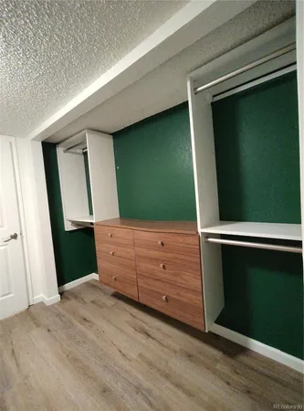 a room with window and hardwood