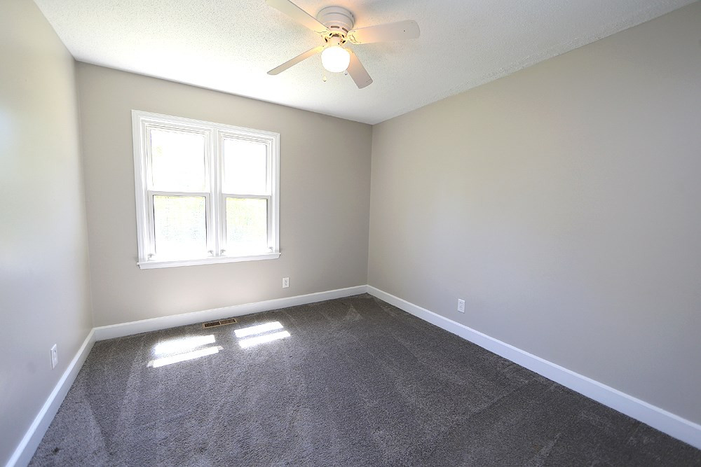 3312 High Gate Road Raleigh, NC 27603 - Photo 16 of 22 Secondary bedroom with ceiling fan - nice closet space.