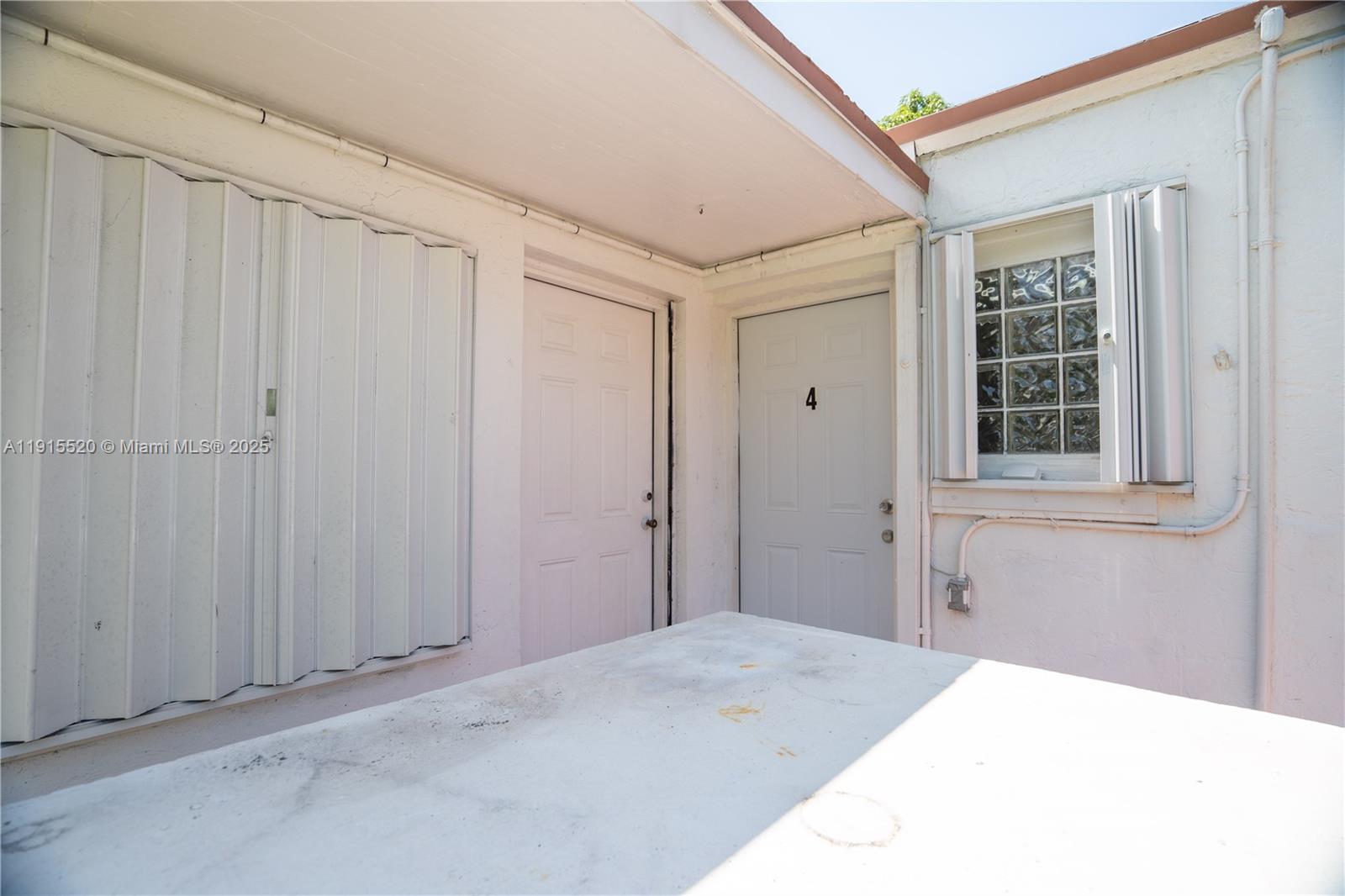 435 Southwest 33rd Avenue, Unit 4 Miami, FL 33135 - Photo 17 of 22 a bedroom with a bed and a window
