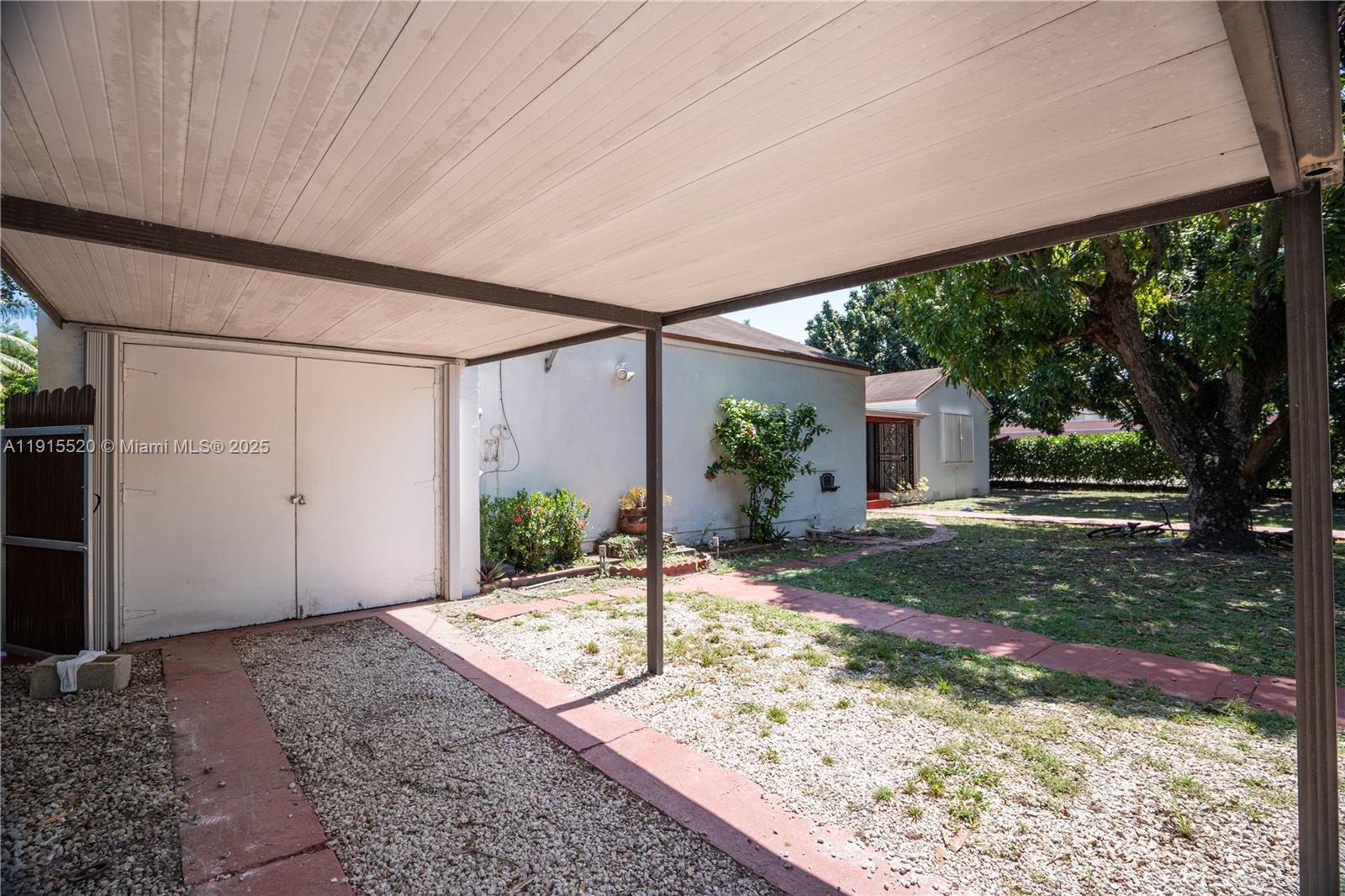 435 Southwest 33rd Avenue, Unit 4 Miami, FL 33135 - Photo 20 of 22 a view of a backyard with a garden and plants