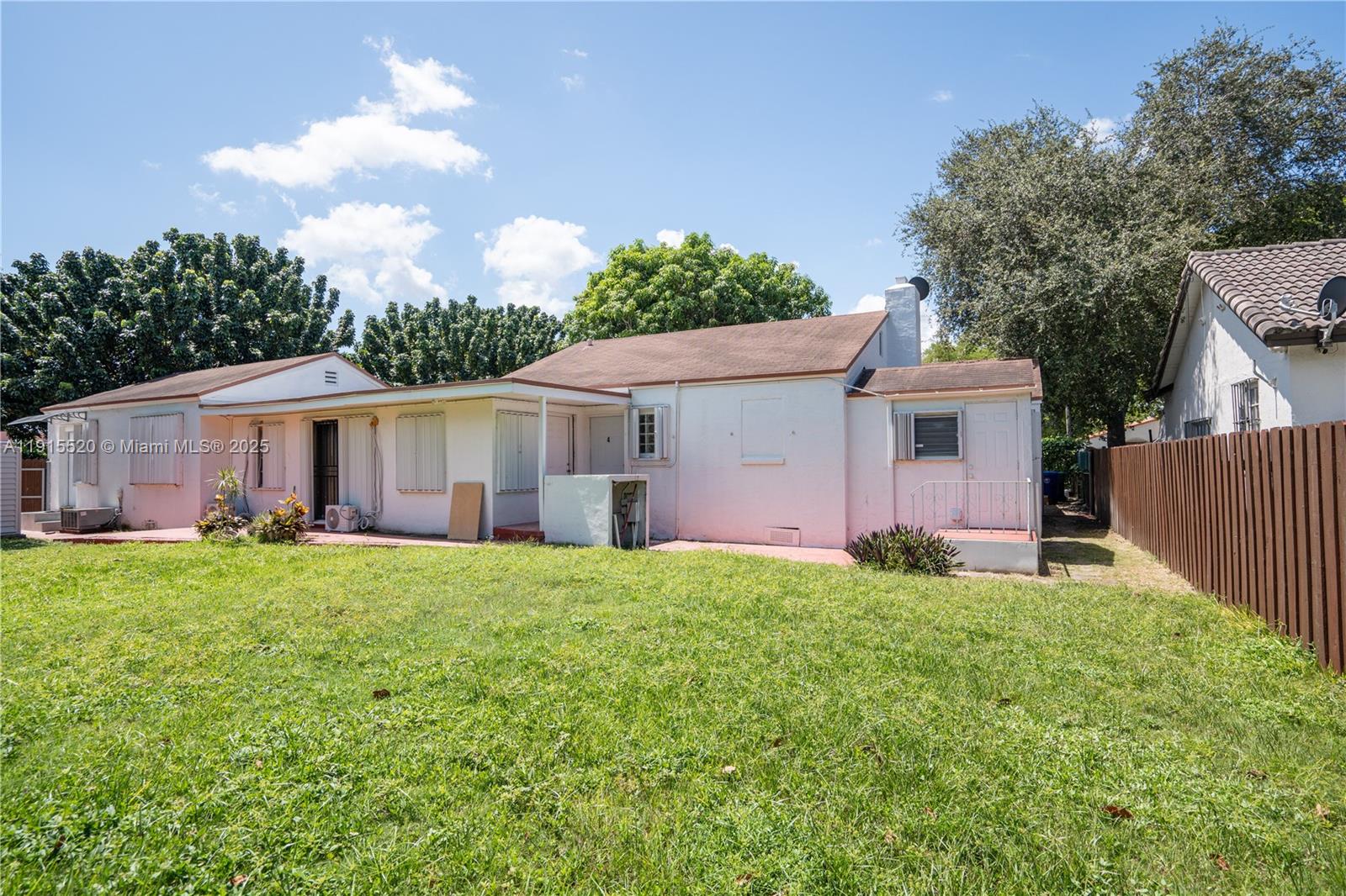 435 Southwest 33rd Avenue, Unit 4 Miami, FL 33135 - Photo 22 of 22 a front view of house with yard and trees
