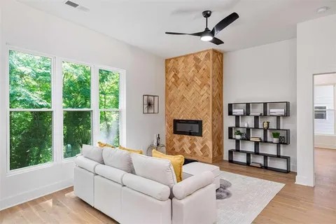 a living room with furniture and a large window