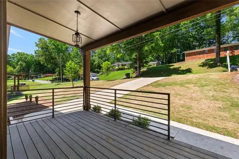 a view of a patio with wooden floor yard