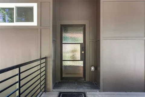 a view of a hallway view with staircase