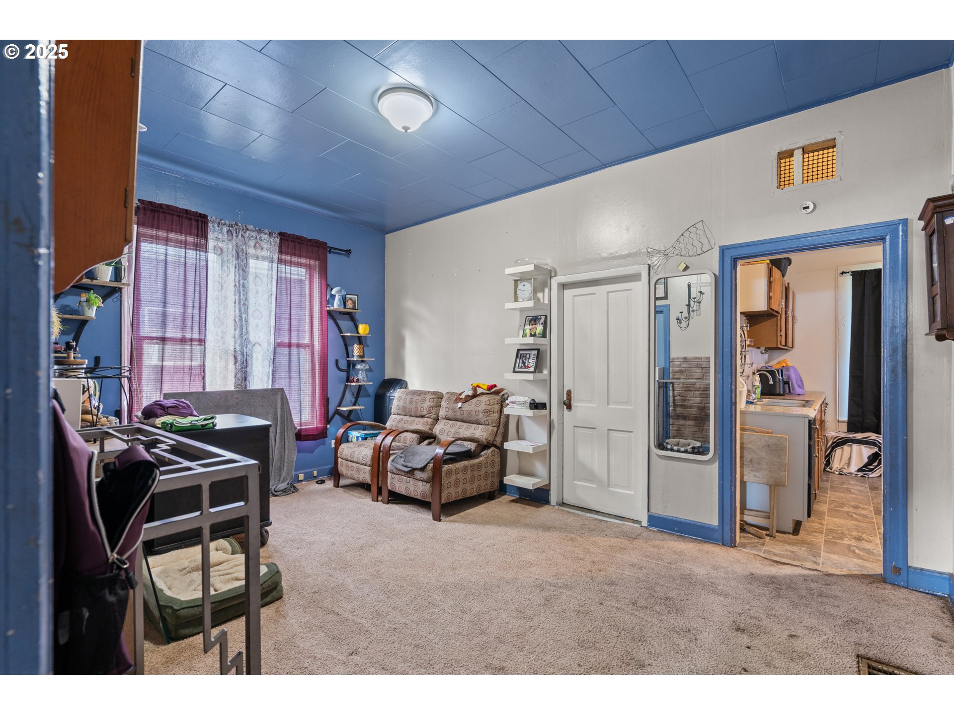 615 Southwest 5th Street Pendleton, OR 97801 - Photo 12 of 27 a living room with furniture a flat screen tv and a window