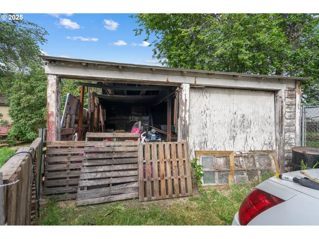 a view of a porch with furniture and garden