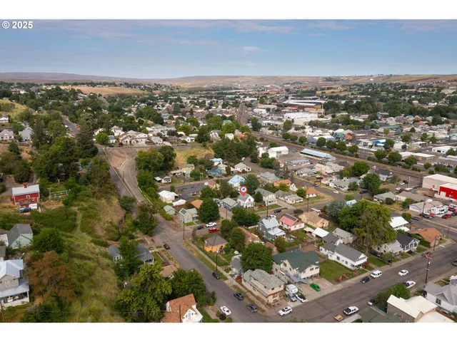 an aerial view of residential houses with outdoor space