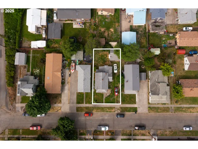 an aerial view of a house with a garden