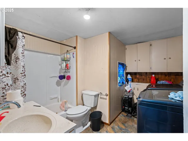 a kitchen with a sink and a stove top oven