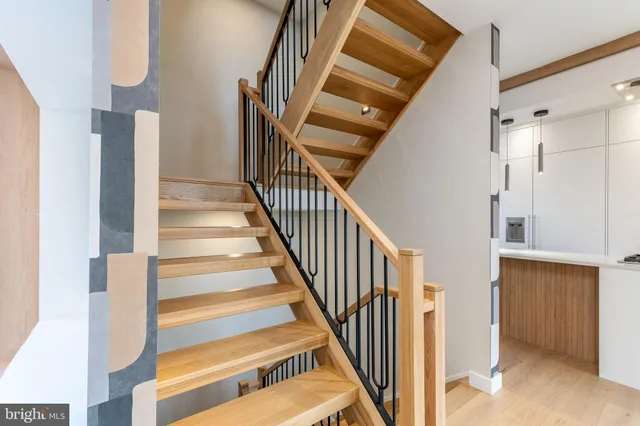 a view of an empty room with a window and fireplace