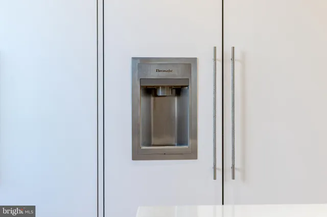 a spacious bathroom with a double vanity sink and a bathtub