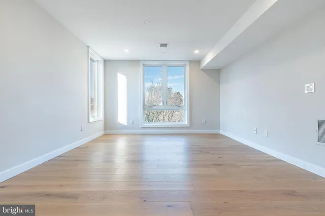 a view of empty room with windows