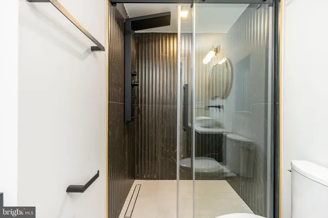 an aerial view of residential houses with a city view