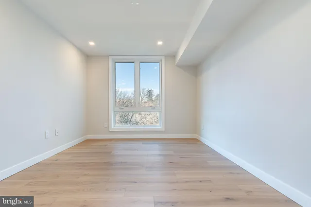 a view of balcony with wooden floor and outdoor seating