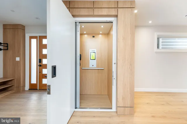 a view of a bathroom with a glass door shower