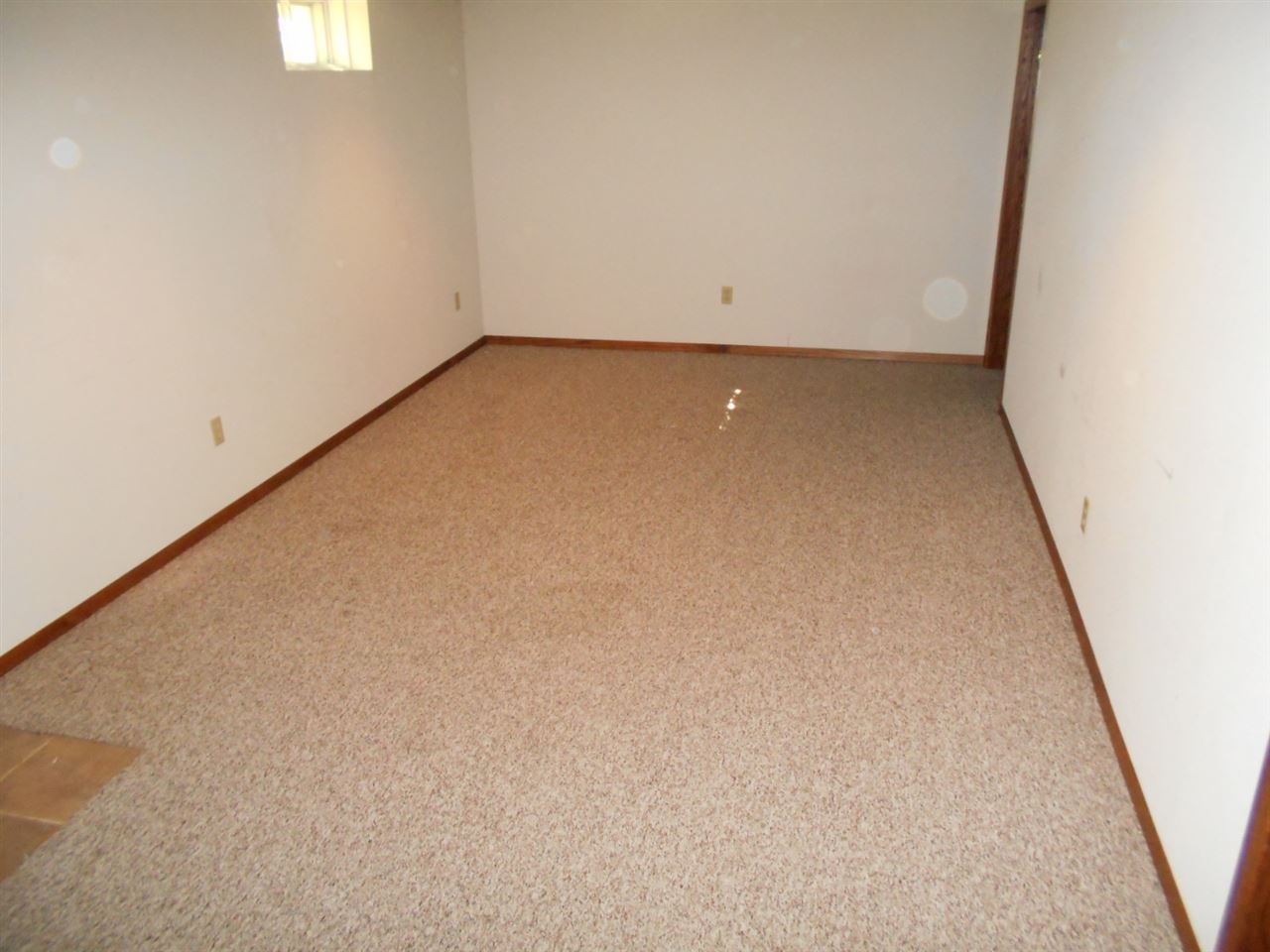 1919 Brownfield Road Rockford, IL 61108 - Photo 8 of 9 an empty room with a window
