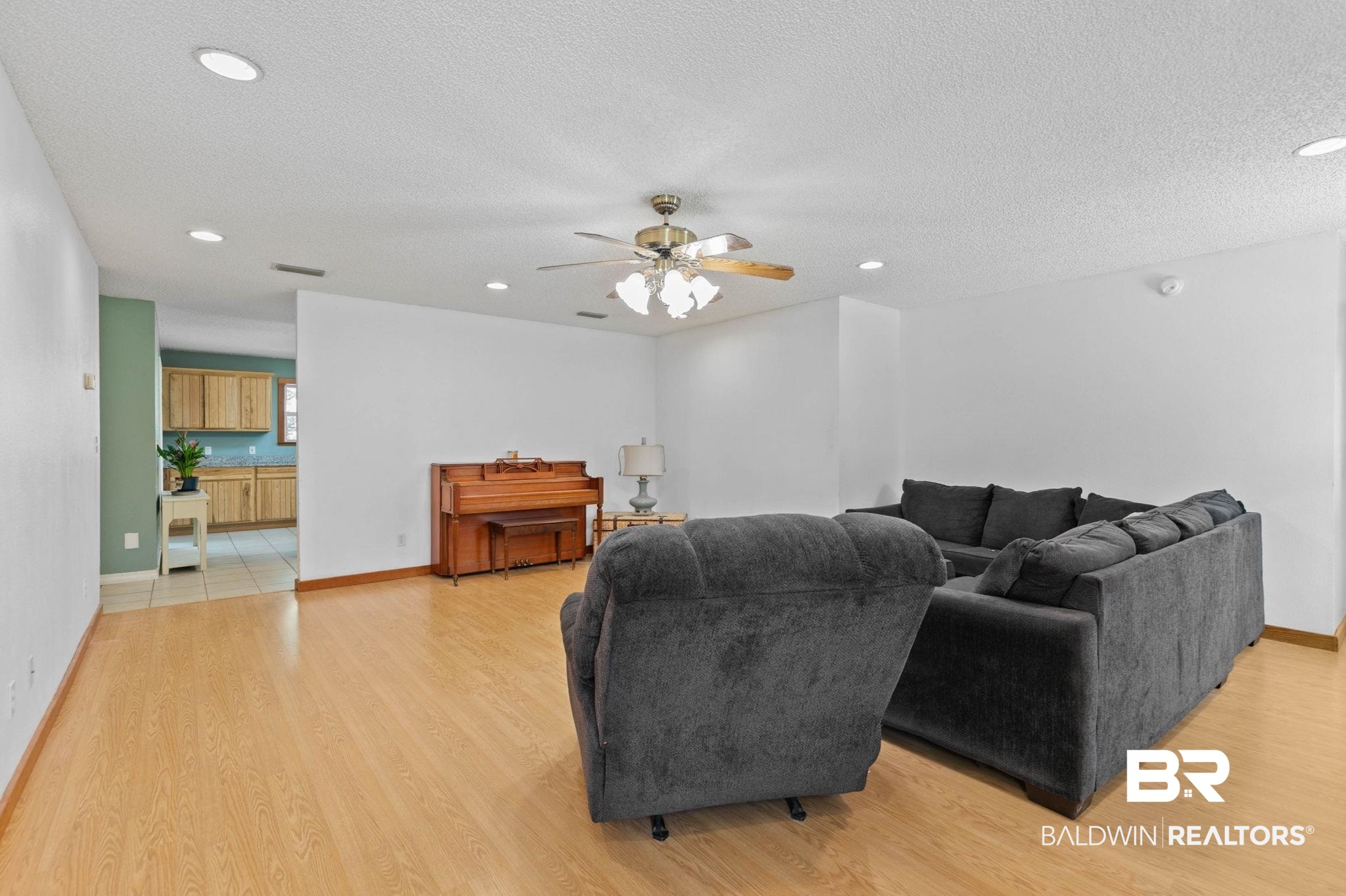 20219 Greek Cemetery Road Robertsdale, AL 36567 - Photo 15 of 41 Spacious open-concept living area featuring light wood-finish flooring, recessed lighting, and a ceiling fan