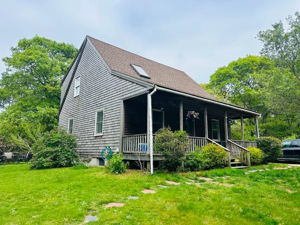 a view of a house with a yard and plants
