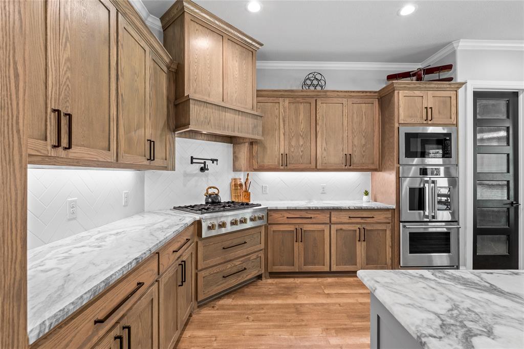 6707 Anchor Quinlan, TX 75474 - Photo 14 of 40 Tons of cabinetry, coveted gas burner, pot filler