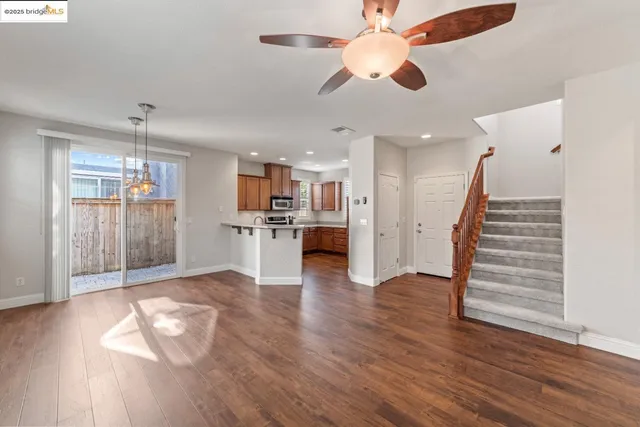a view of kitchen with furniture and wooden floor