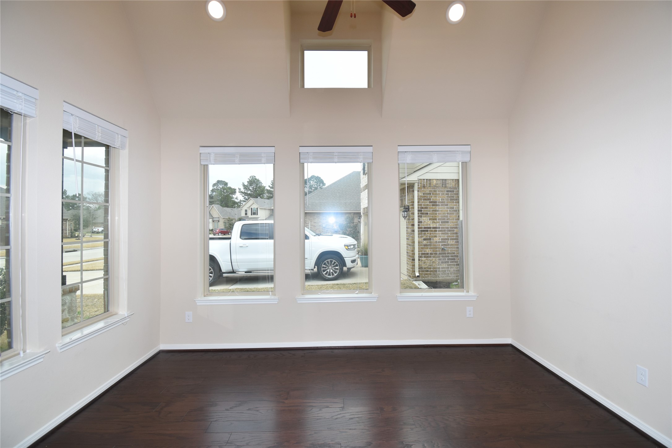 22219 Ebbets Field Drive Spring, TX 77389 - Photo 11 of 22 an empty room with wooden floor and windows
