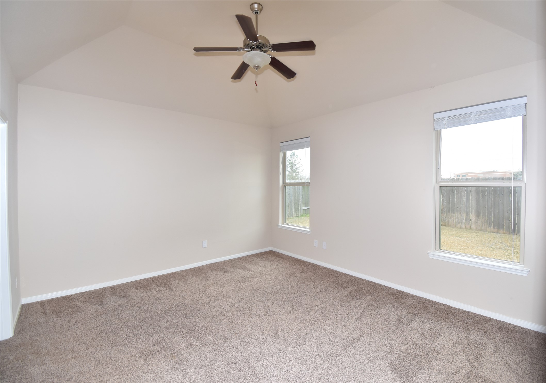 22219 Ebbets Field Drive Spring, TX 77389 - Photo 13 of 22 an empty room with a window and a fan