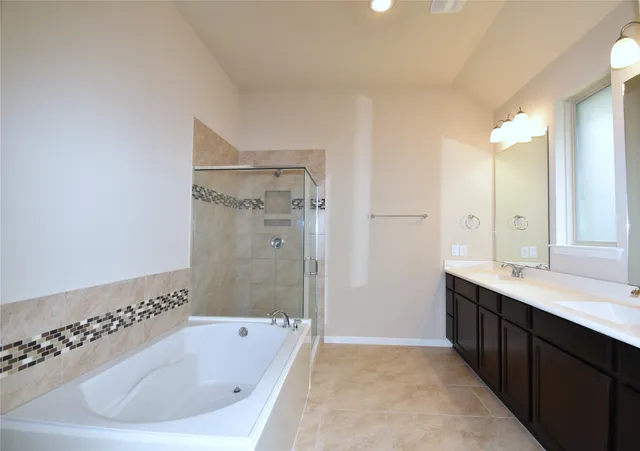 a bathroom with a bathtub and a sink