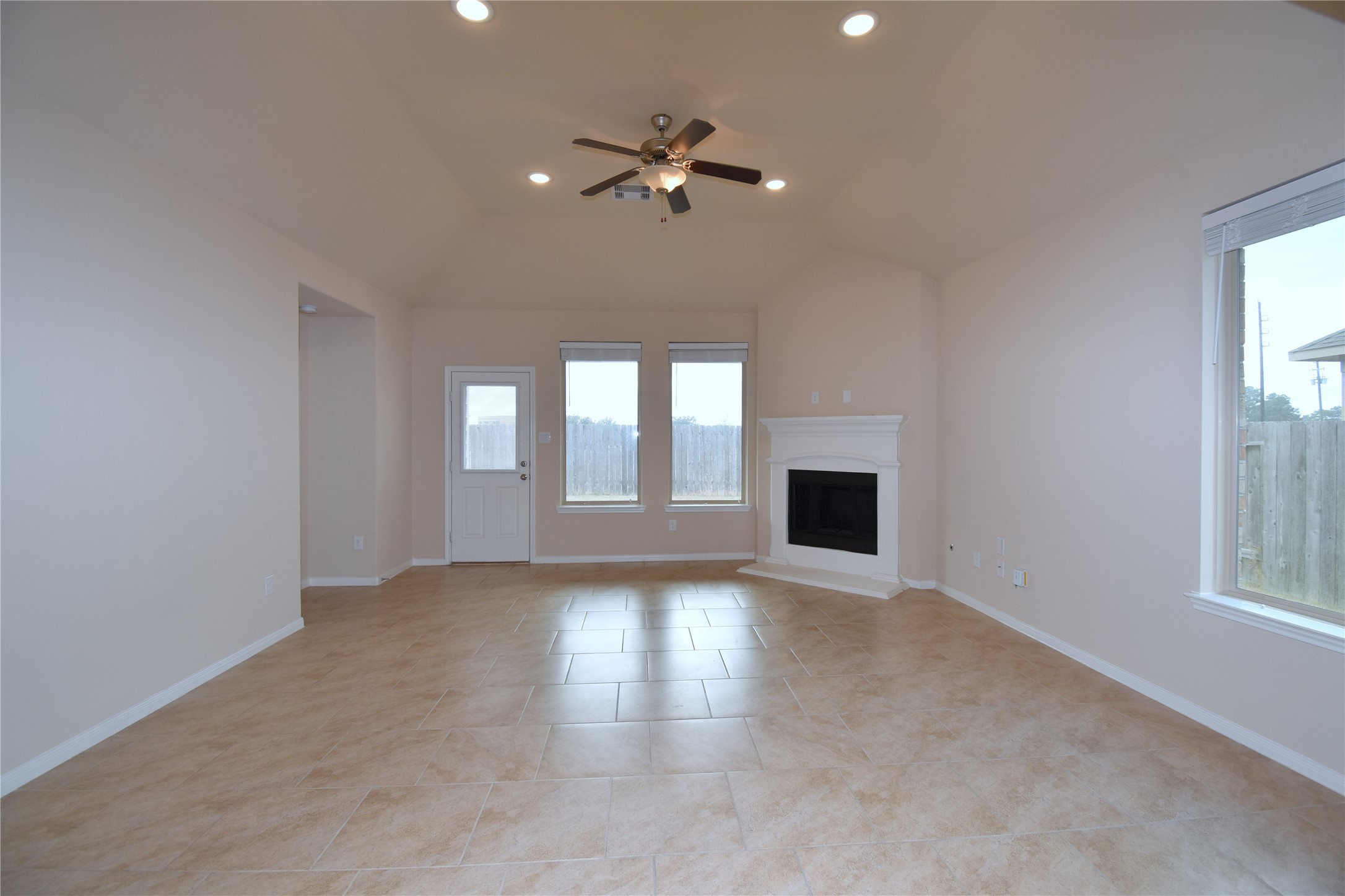 22219 Ebbets Field Drive Spring, TX 77389 - Photo 20 of 22 a view of an empty room with a window and wooden floor